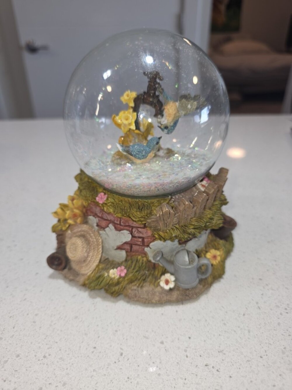 Snowglobe Birds Tune Is A BIrd In a Glided Cage.